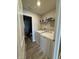 Convenient laundry room featuring modern, full size washer and dryer and overhead shelving at 10950 N Heirloom Dr, Monrovia, IN 46157