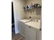 Laundry area with washer and dryer and storage shelves for laundry products and supplies at 10950 N Heirloom Dr, Monrovia, IN 46157