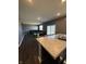 Open-concept living area with an island that overlooks the dining and living areas at 10950 N Heirloom Dr, Monrovia, IN 46157