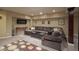 Cozy basement with plush seating, entertainment area, and modern lighting at 11458 Falling Water Way, Fishers, IN 46037