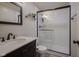 Modern bathroom features a glass enclosed shower and sleek fixtures at 11458 Falling Water Way, Fishers, IN 46037