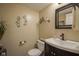 Modern powder room with a sleek vanity, decorative mirror, and stylish wall decor at 11458 Falling Water Way, Fishers, IN 46037
