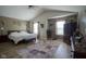 Spacious bedroom with wooden floors, complemented by a plush rug and ample natural light at 11458 Falling Water Way, Fishers, IN 46037