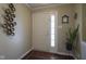 Inviting entryway featuring a front door with sidelight, hardwood floors and decorative wall art at 11458 Falling Water Way, Fishers, IN 46037