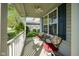 Charming covered porch with a ceiling fan and seating, perfect for relaxing outdoors at 11458 Falling Water Way, Fishers, IN 46037