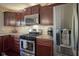 Kitchen featuring stainless steel appliances, gas range, and tile backsplash at 11458 Falling Water Way, Fishers, IN 46037