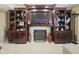 Living room with built-in shelving and fireplace at 11458 Falling Water Way, Fishers, IN 46037