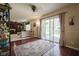 Open living room with views to outside deck and fireplace at 11458 Falling Water Way, Fishers, IN 46037