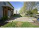 Paver patio with a pergola provides a perfect outdoor living space, complemented by landscaping and a fire pit at 11458 Falling Water Way, Fishers, IN 46037