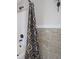 Close-up of tiled shower and tub showcasing stylish tile detail at 11458 Falling Water Way, Fishers, IN 46037
