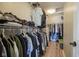 Organized walk-in closet with ample storage space for clothing at 11458 Falling Water Way, Fishers, IN 46037