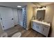 Bathroom with modern white vanity and tub and shower combo at 117 N 10Th St, Elwood, IN 46036