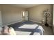 Bright bedroom with a comfortable bed, soft carpet, and an inviting doorway at 117 N 10Th St, Elwood, IN 46036