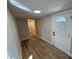 Hallway featuring durable floors, recessed lighting, and a modern utility space at 117 N 10Th St, Elwood, IN 46036