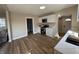 Bright kitchen with stainless steel appliances, white cabinets and hardwood floors at 117 N 10Th St, Elwood, IN 46036