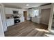 Modern kitchen with stainless steel appliances, white cabinets, and plenty of counter space at 117 N 10Th St, Elwood, IN 46036