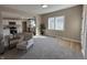 Bright living room with kitchen view, neutral colors and comfortable seating at 117 N 10Th St, Elwood, IN 46036