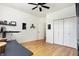 Bright bedroom with hardwood floors, closet, and natural light at 1209 N Rural St, Indianapolis, IN 46201