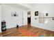 Bright bonus room with hardwood floors, exercise equipment, and natural light at 1209 N Rural St, Indianapolis, IN 46201