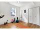 Bright bonus room with hardwood floors, fitness equipment, and natural light at 1209 N Rural St, Indianapolis, IN 46201