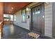 Inviting front porch with warm lighting, neutral siding, and an elegant entryway at 1209 N Rural St, Indianapolis, IN 46201