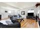 Cozy living room with hardwood floors, a modern sofa, and a stylish glass coffee table at 1209 N Rural St, Indianapolis, IN 46201