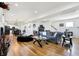 Open-concept living room with hardwood floors, comfortable seating, and modern decor at 1209 N Rural St, Indianapolis, IN 46201