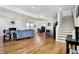 Spacious living room showcasing hardwood floors, a cozy fireplace, and ample natural light at 1209 N Rural St, Indianapolis, IN 46201