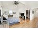Bright bedroom features a high vaulted ceiling, wood floors, and a walk-in closet at 1209 N Rural St, Indianapolis, IN 46201