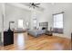Bright bedroom features a high vaulted ceiling, wood floors, and neutral décor at 1209 N Rural St, Indianapolis, IN 46201