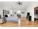 Bright bedroom features a high vaulted ceiling, wood floors, and a walk-in closet at 1209 N Rural St, Indianapolis, IN 46201