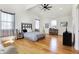 Bright bedroom features a high vaulted ceiling, wood floors, and neutral décor at 1209 N Rural St, Indianapolis, IN 46201