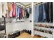 Organized walk-in closet featuring ample hanging space, shoe racks, and overhead storage at 1209 N Rural St, Indianapolis, IN 46201