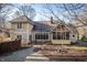 Exterior featuring a brick patio, screened porch, and landscaped backyard at 12348 Seaway Cir, Indianapolis, IN 46236