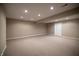 Expansive finished basement with recessed lighting and neutral carpet flooring at 12348 Seaway Cir, Indianapolis, IN 46236
