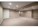 Spacious basement featuring recessed lighting, neutral carpet flooring and a door at 12348 Seaway Cir, Indianapolis, IN 46236