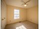 Bedroom featuring carpet floors, a window, and double closet doors at 12348 Seaway Cir, Indianapolis, IN 46236