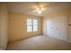 Bedroom with a ceiling fan, window and closet doors at 12348 Seaway Cir, Indianapolis, IN 46236