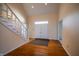 Welcoming foyer with hardwood floors, staircase, and double front doors at 12348 Seaway Cir, Indianapolis, IN 46236