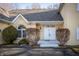 Home's entryway featuring a double door and manicured shrubs at 12348 Seaway Cir, Indianapolis, IN 46236