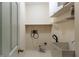 Functional laundry room with utility sink, shelving, and ample space at 12348 Seaway Cir, Indianapolis, IN 46236