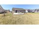 Backyard with patio, chairs and a table plus view of the home's back at 1269 Frogs Leap, Cicero, IN 46034