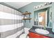 Bathroom with vanity, mirror and a shower with white and gray curtain at 1269 Frogs Leap, Cicero, IN 46034