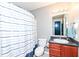 Bathroom features a shower-tub combo with a blue and white striped curtain at 1269 Frogs Leap, Cicero, IN 46034
