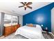 Cozy bedroom featuring a blue accent wall and a large window for natural light at 1269 Frogs Leap, Cicero, IN 46034