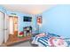 Blue bedroom with baseball decor, entertainment center, and view to hall at 1269 Frogs Leap, Cicero, IN 46034