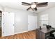 Neutral bedroom featuring a ceiling fan, light grey walls and a workstation or desk at 1269 Frogs Leap, Cicero, IN 46034