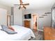 Bedroom showcasing the wood-look floors, ceiling fan and access to the bathroom at 1269 Frogs Leap, Cicero, IN 46034