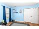 A blue bedroom with a large window, decor, and a closet at 1269 Frogs Leap, Cicero, IN 46034