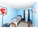 A bedroom featuring bright blue walls and baseball themed decor at 1269 Frogs Leap, Cicero, IN 46034